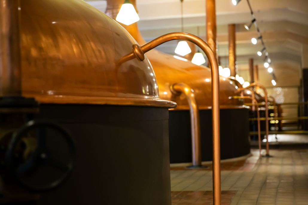 Copper brewing kettles in brewery